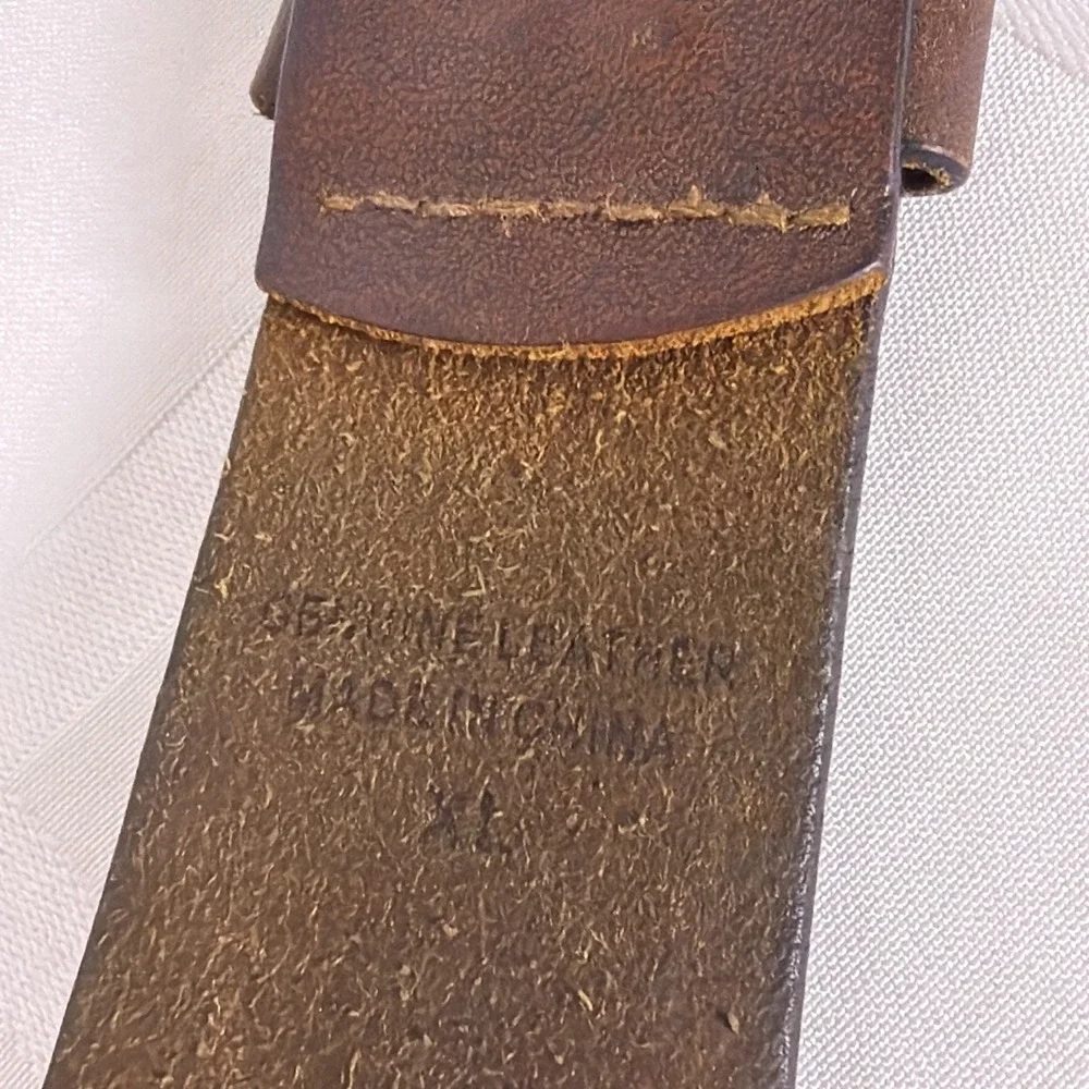 Dark Brown Leather belt with silver buckle and accents. Size XL
